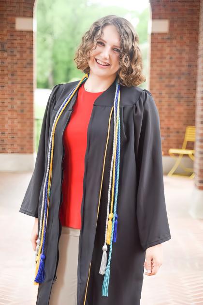 Portrait photo of Pava LaPere in a graduation gown.